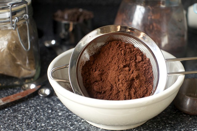 sifting dark cocoa powder